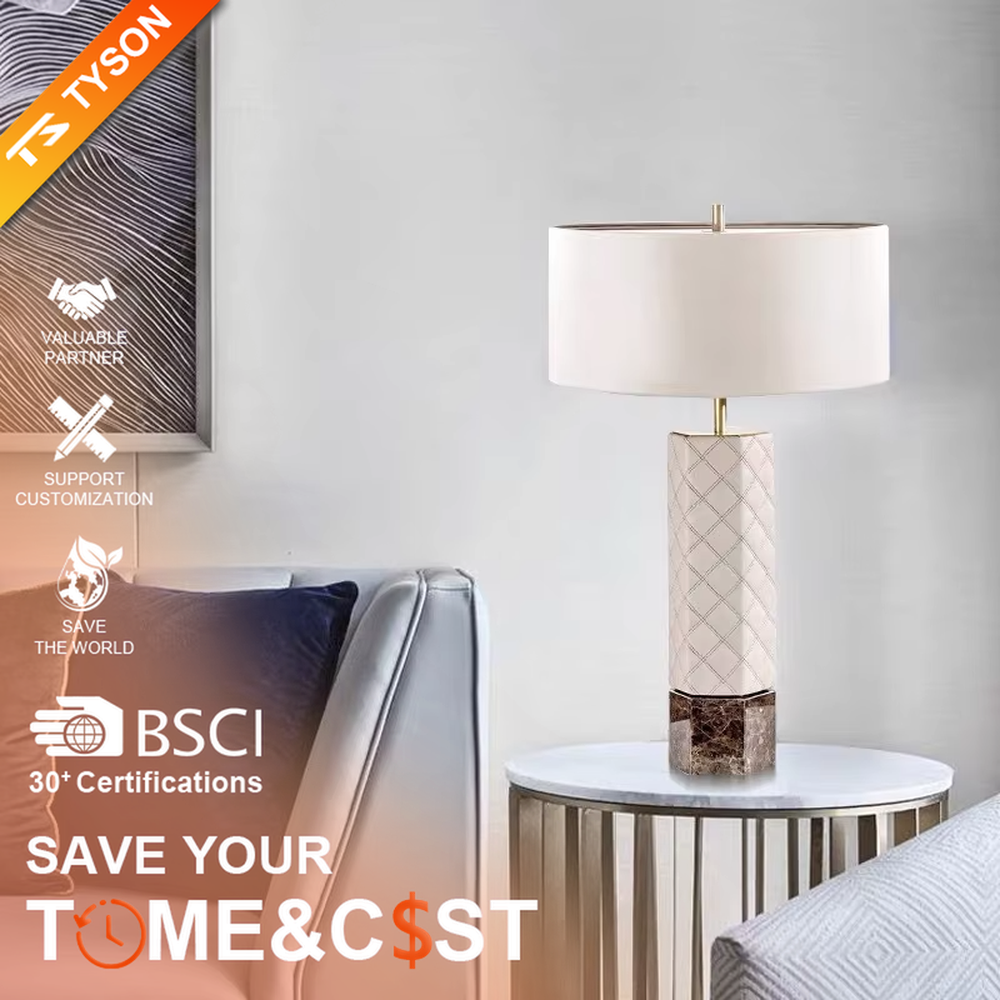 This is a light luxury elegant-style geometric textured column table lamp, with a beige fabric round lampshade, paired with golden metal connectors and a geometric textured column (marble texture at the bottom). It features an exquisite light luxury design, with warm and soft lighting. It is used for local desktop lighting and decoration, creating a light luxury elegant atmosphere. Suitable for light luxury-style bedroom bedside tables, modern minimalist living room side tables, high-end hotel guest rooms and other places.