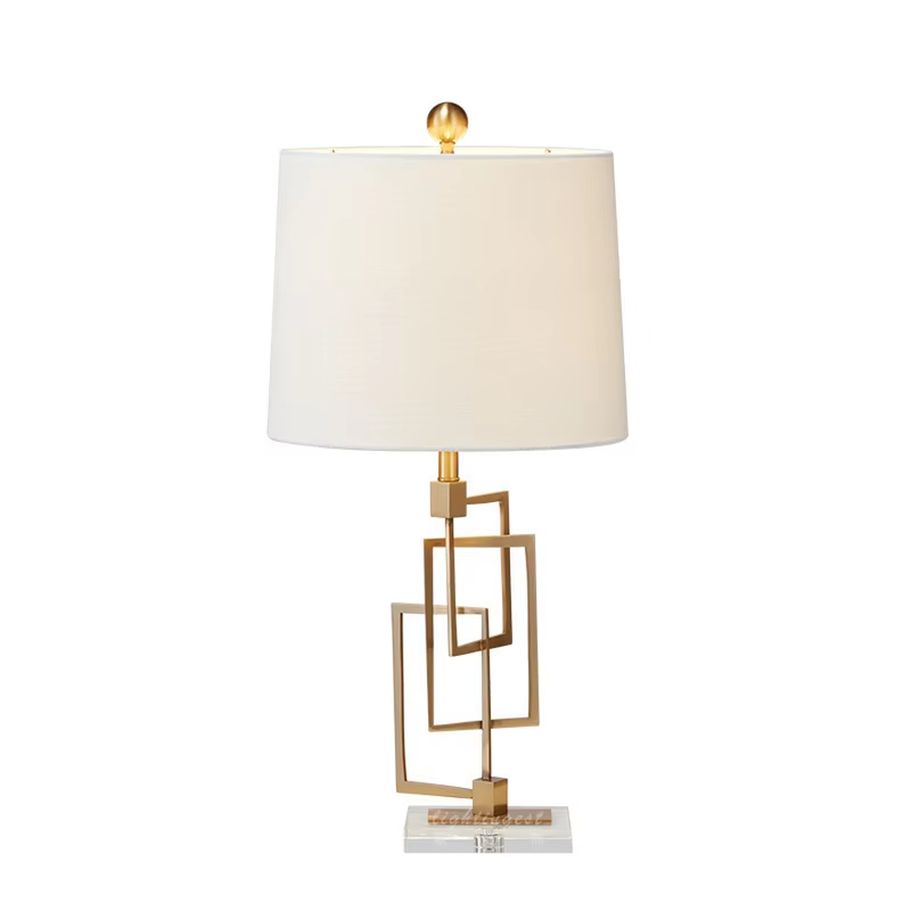 Light luxury modern geometric square frame gold stand table lamp, golden multi-layer square frame stand + beige fabric cylindrical lampshade + white stone base, soft and high-end lighting, creating a light luxury minimalist atmosphere.