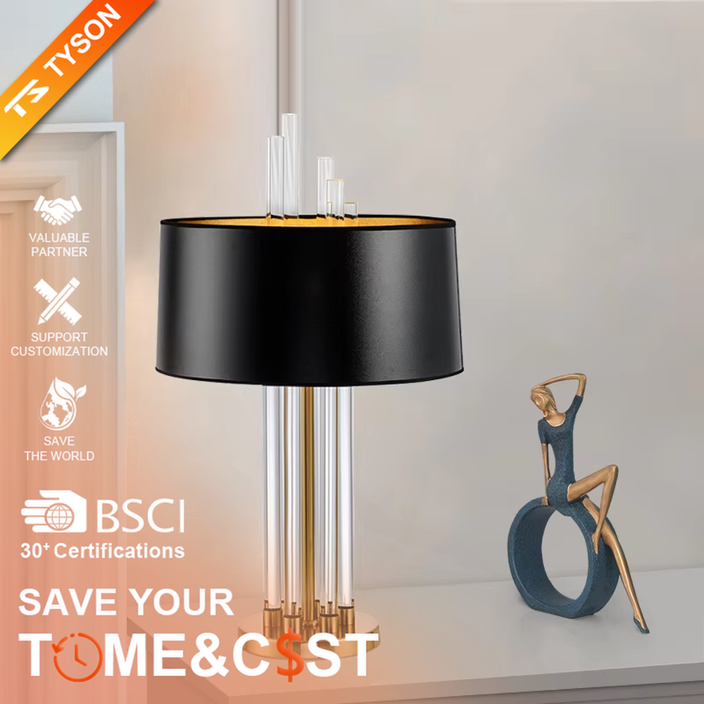 Modern Light Luxury Gold & Crystal Table Lamp, Black Cylindrical Fabric Lampshade (Gold Interior), Transparent Crystal Strips and Gold Metal Strips Combined Lamp Body with Crystal Decor on Top, Serves Both Lighting and Decorative Purposes, Ideal for Living Rooms, Bedrooms, Studies, Hotel Guest Rooms and Other Light Luxury Spaces.