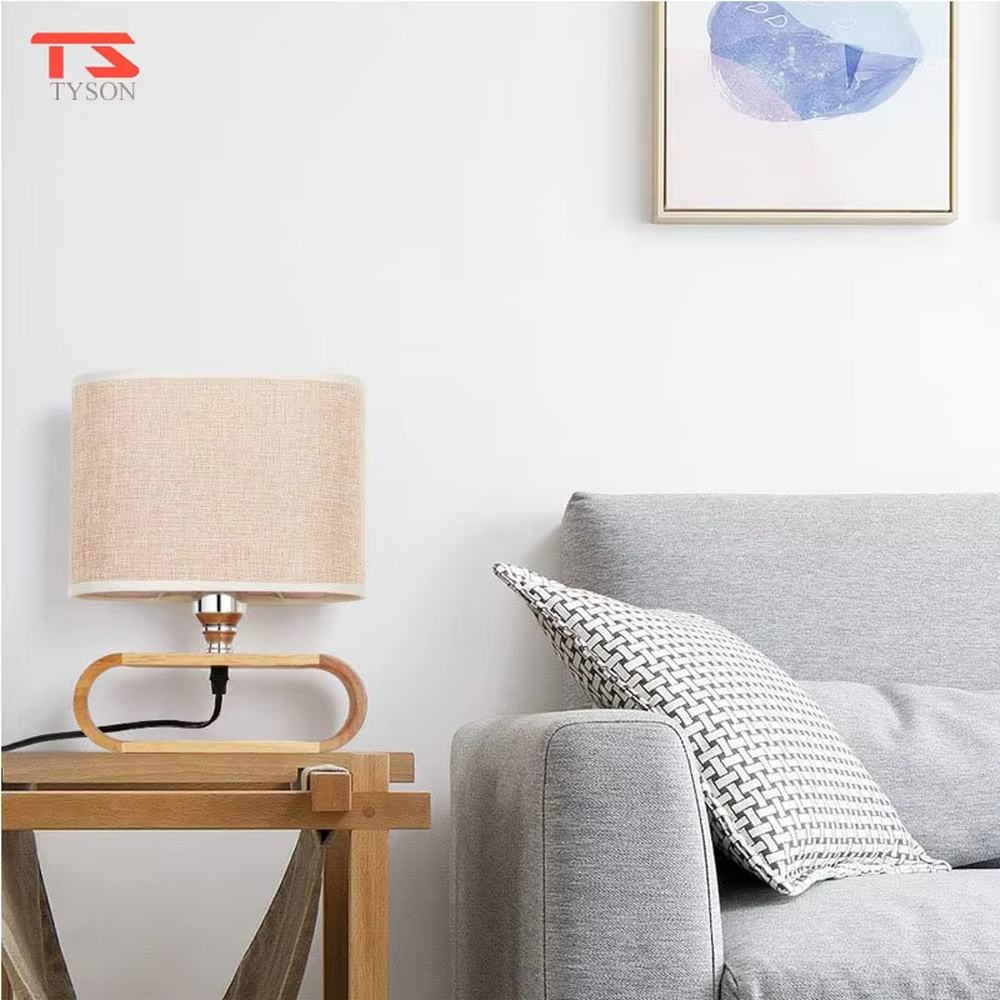 This is a Nordic minimalist style wooden table lamp, featuring a curved solid wood stand paired with a linen fabric lampshade. It emits soft and warm light, serving both lighting and decorative purposes, suitable for bedroom nightstands, living room side tables, studies, homestay guest rooms and other scenarios.