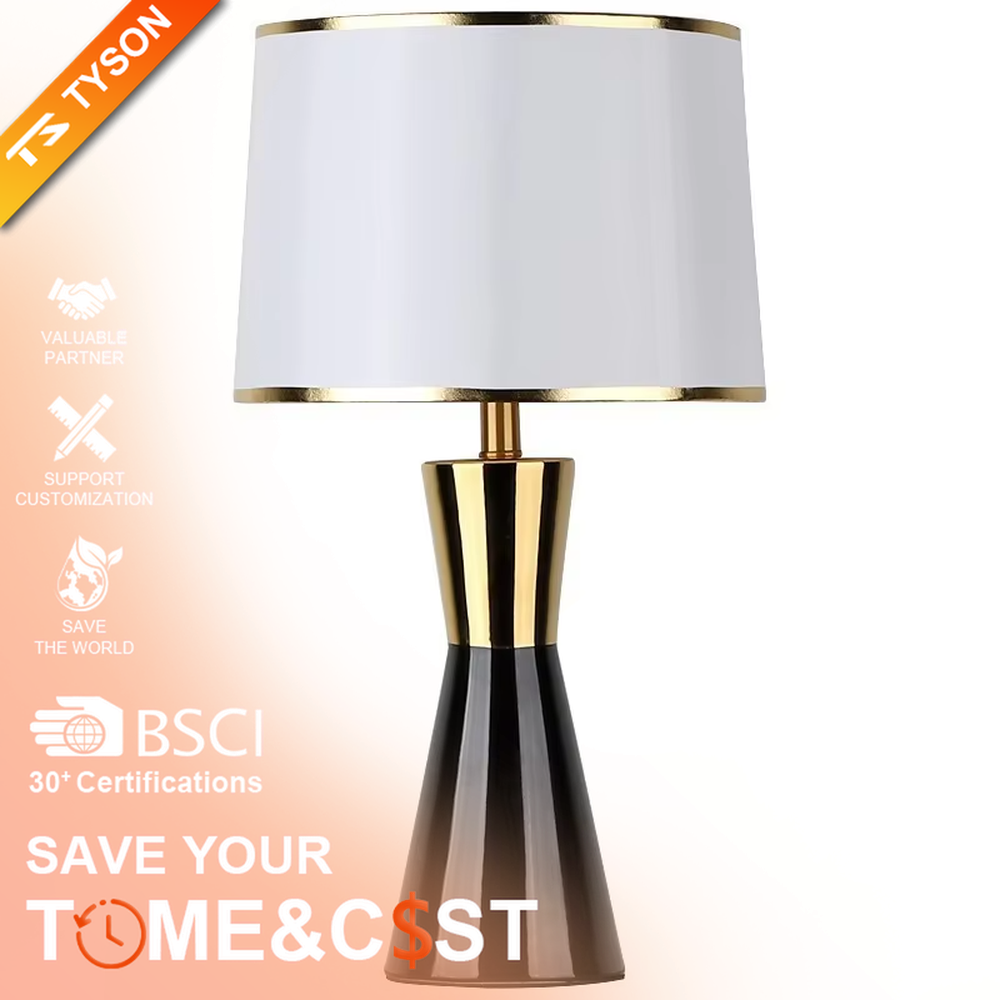 This is a light luxury black-gold table lamp, with a black fabric lampshade edged with gold trim, and a cone-shaped base with a black-gold color block design, featuring both decorative and lighting functions, ideal for high-end indoor scenarios such as bedroom nightstands and living room side tables.