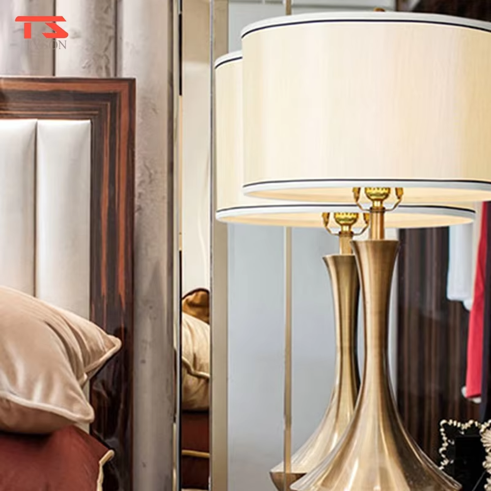 Modern minimalist silver bottle-shaped metal pole light beige fabric shade table lamp, warm light effect, creating an elegant light luxury home atmosphere.