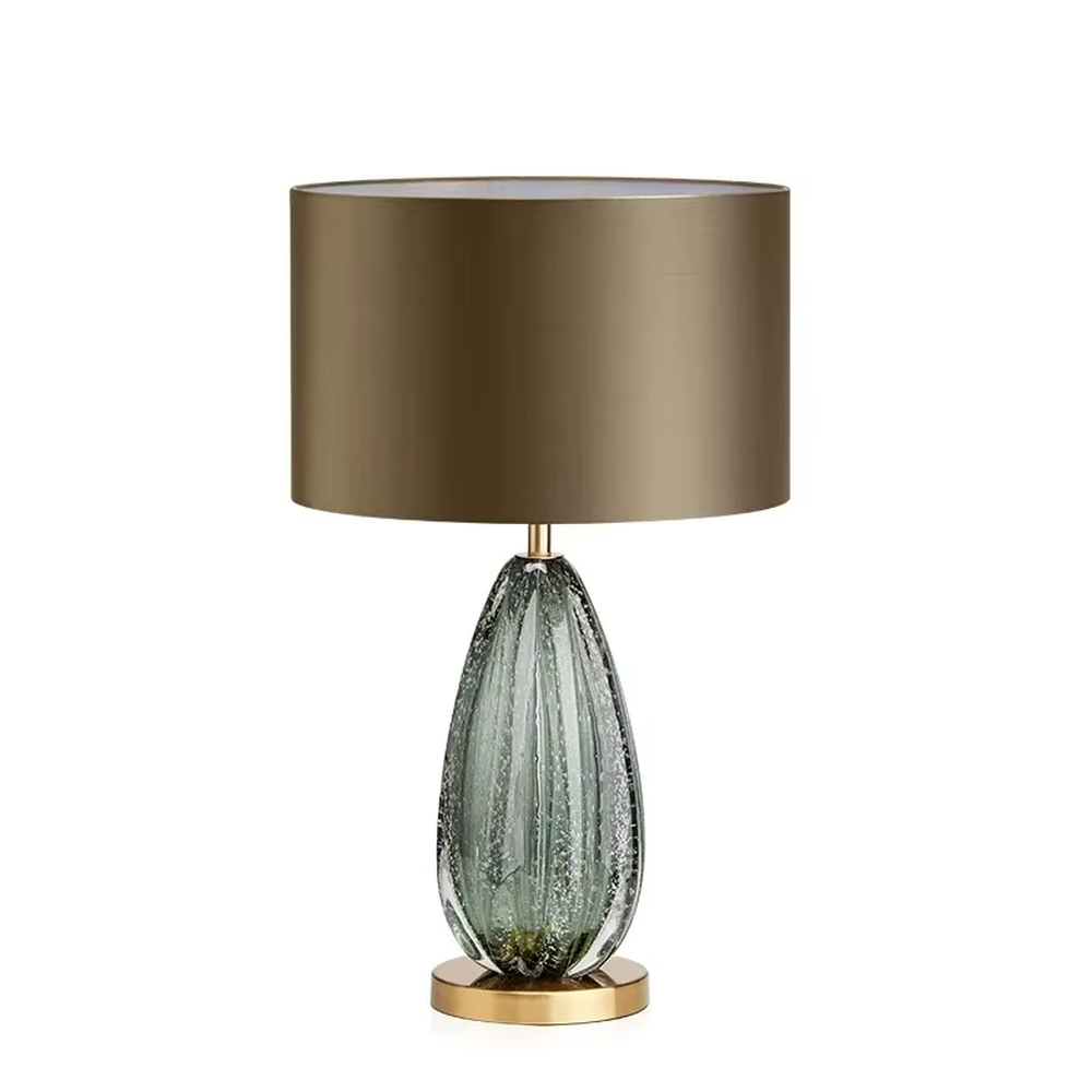 Light luxury textured glass table lamp (dark green glass + metal base), warm light effect, creating an elegant and high-end home space atmosphere.