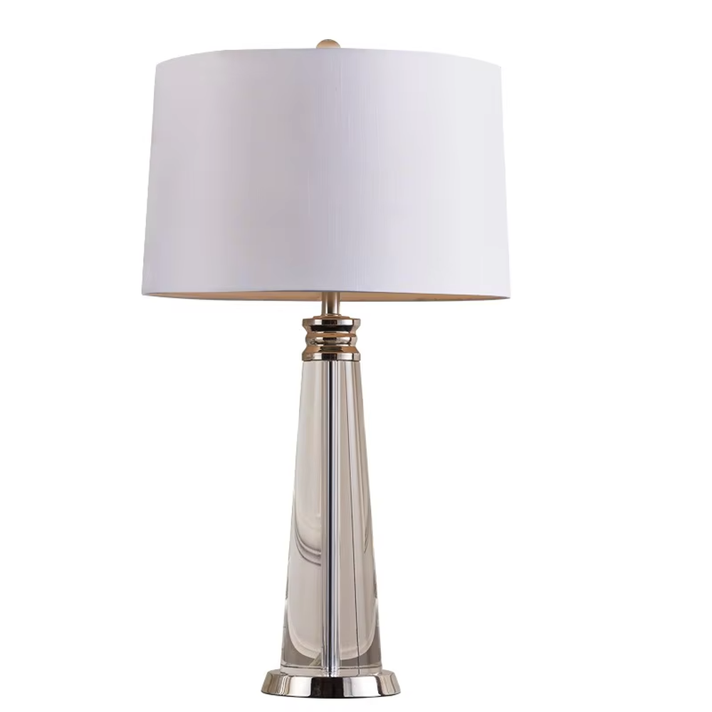 Light luxury crystal column table lamp, transparent cut crystal column base with silver metal details and white fabric lampshade, available in a set of two sizes, soft and even light, designed to enhance the delicate and elegant atmosphere of spaces, suitable for bedroom nightstands, living room side tables, modern light luxury homes and hotel guest rooms, etc.