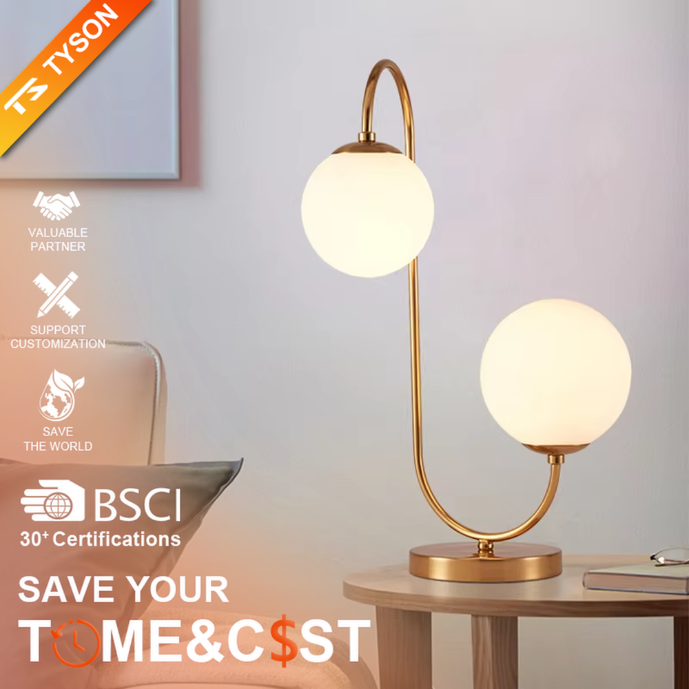 Light luxury double-ball curved table lamp (gold metal curved bracket + double milk-white glass ball lampshades + round metal base), warm light effect, creating a modern and elegant home atmosphere.