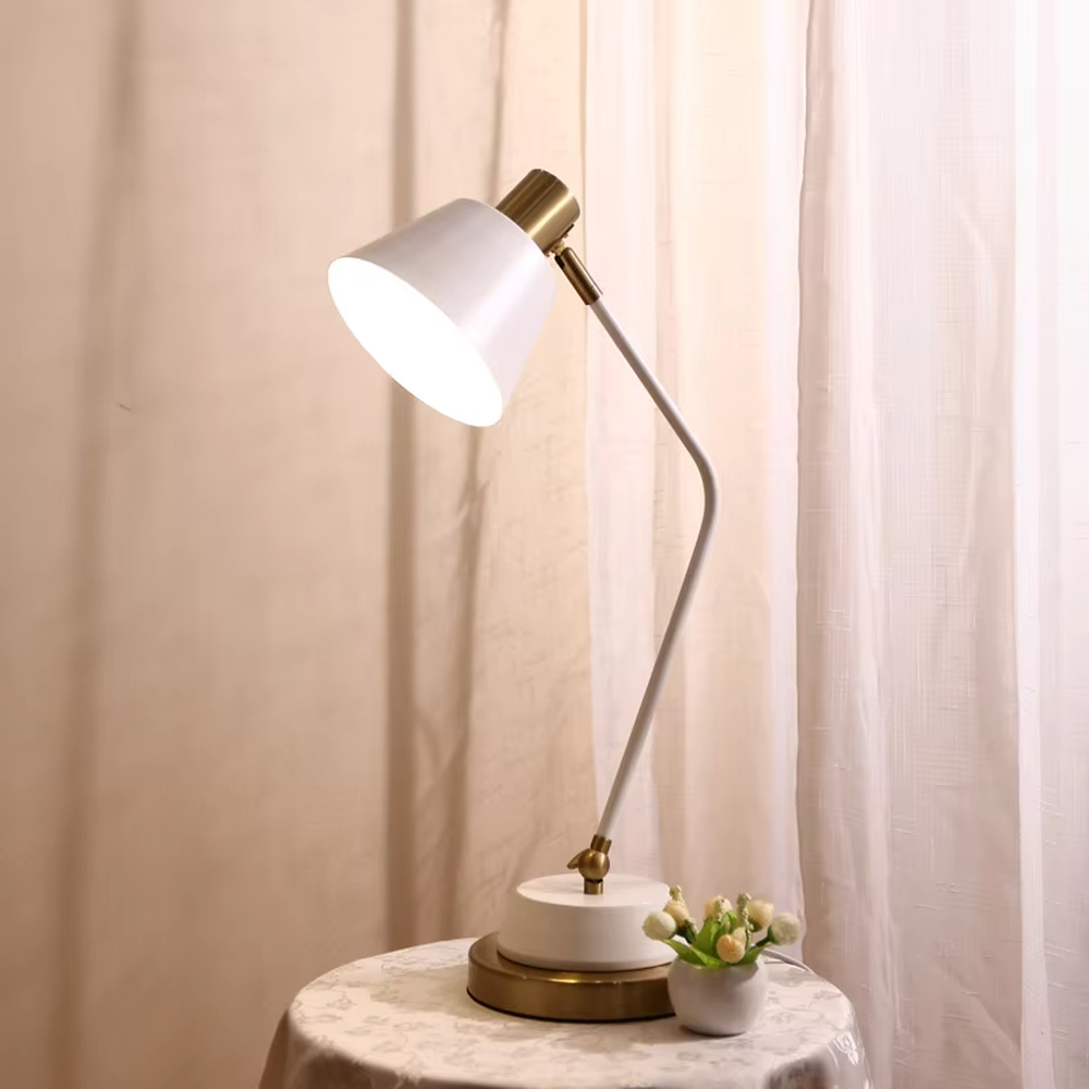 This modern minimalist table lamp features a white-gold color scheme, with a bendable metal arm and a conical lampshade, and a base with gold decoration. It serves both lighting and decorative purposes, ideal for bedroom bedside tables, study desks, light luxury homestays and other scenarios.