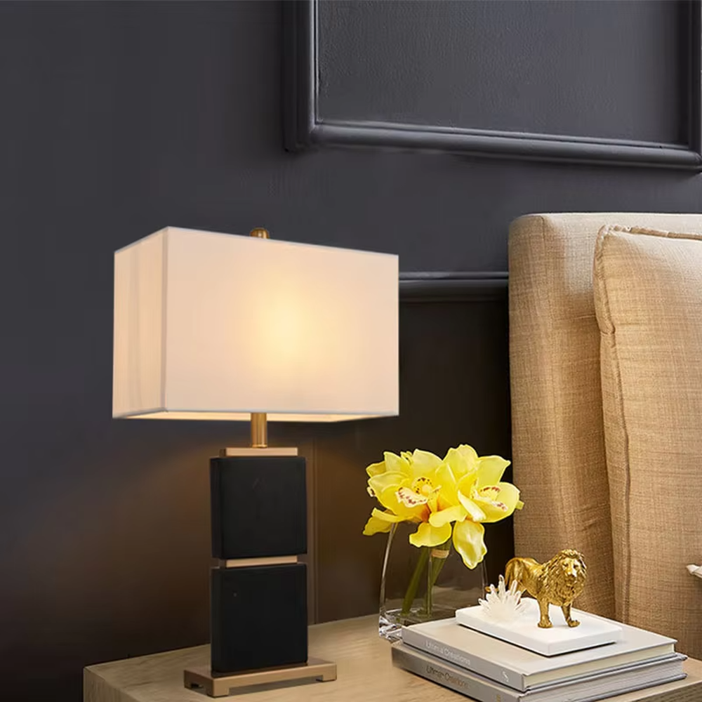 Light luxury stacked marble table lamp, natural marble base with gold metal connections, rectangular fabric lampshade for soft and eye-protective lighting, designed to enhance space texture, suitable for bedroom nightstands, living room side tables, hotel guest rooms, etc.