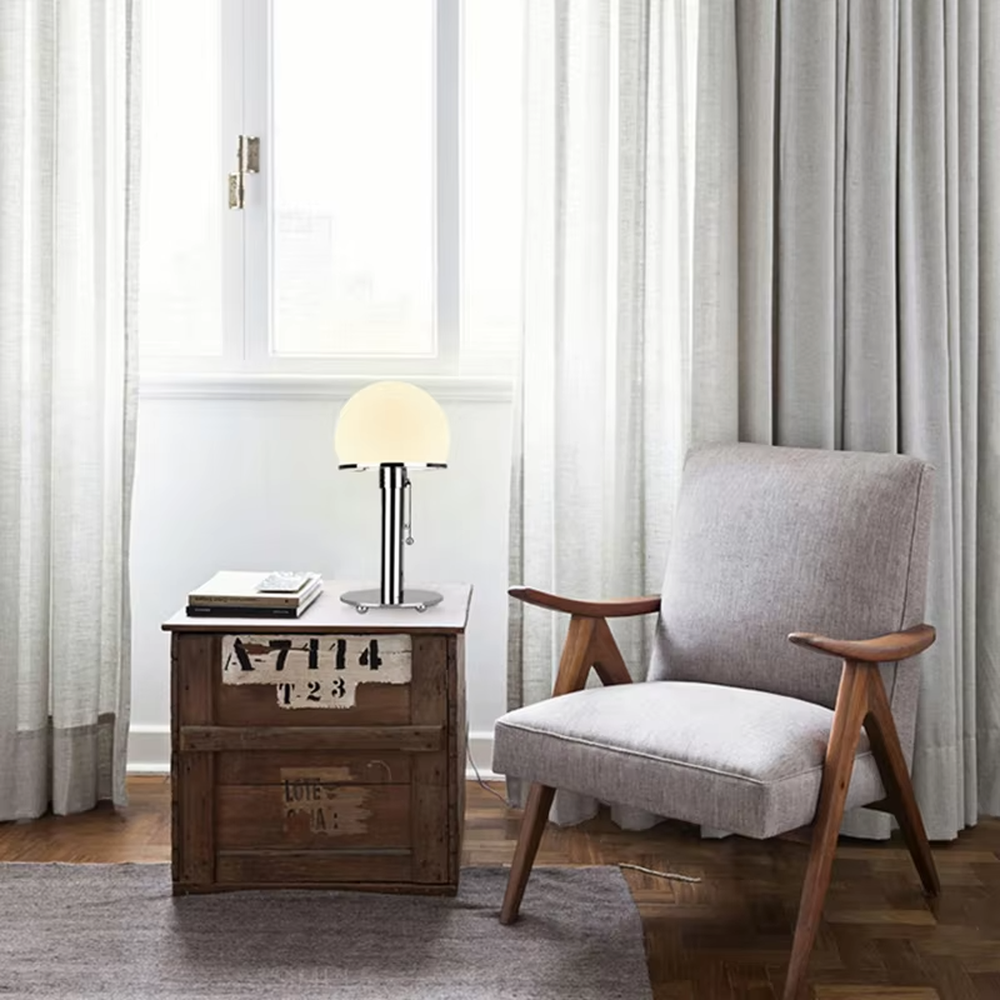 Modern light luxury adjustable-height mushroom table lamp, with a milky white spherical lampshade paired with a chrome-plated + transparent acrylic adjustable-height lamp pole, featuring a pull-chain switch, and a green acrylic base, emitting soft and even light, combining decorativeness and practicality, suitable for lighting and decoration in spaces such as bedroom nightstands, study desks, and living room side tables.