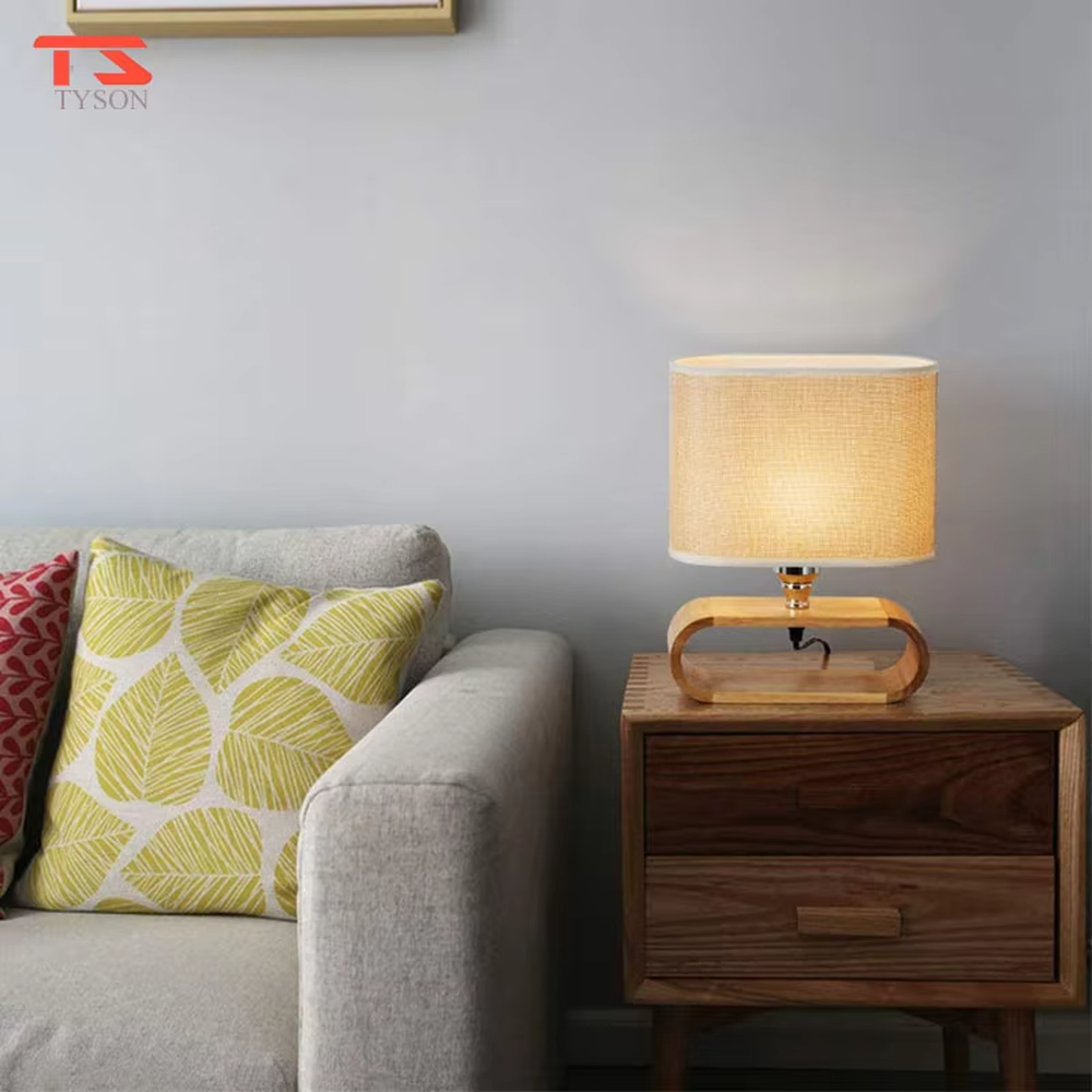 This is a Nordic minimalist style wooden table lamp, featuring a curved solid wood stand paired with a linen fabric lampshade. It emits soft and warm light, serving both lighting and decorative purposes, suitable for bedroom nightstands, living room side tables, studies, homestay guest rooms and other scenarios.