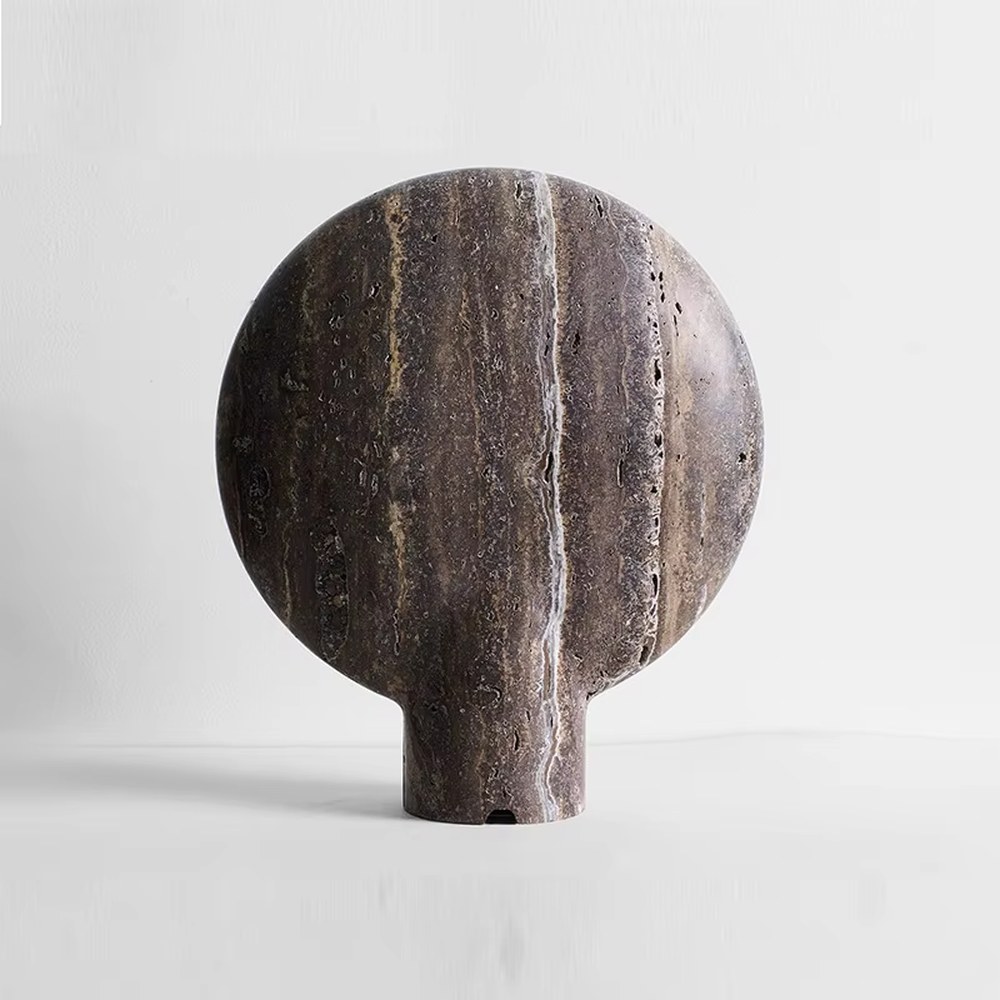 Industrial retro stone-texture base + circular metal texture lampshade table lamp, warm light effect, creating a rustic artistic atmosphere.