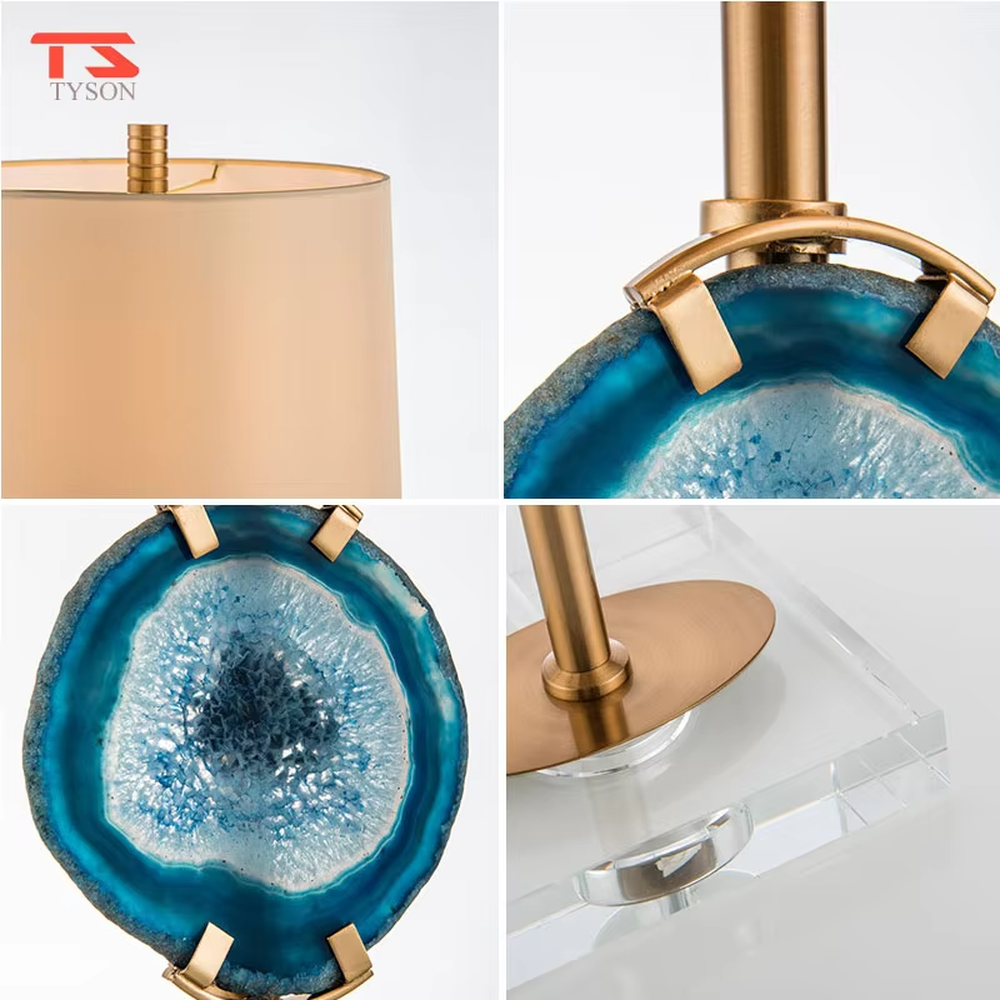 This is a light luxury agate decorative table lamp, with an off-white fabric lampshade paired with a gold metal lamp pole, inlaid with a natural blue agate slice in the middle, and a transparent crystal square base, featuring both decorative and lighting functions, ideal for high-end indoor scenarios such as bedroom nightstands and living room side tables.