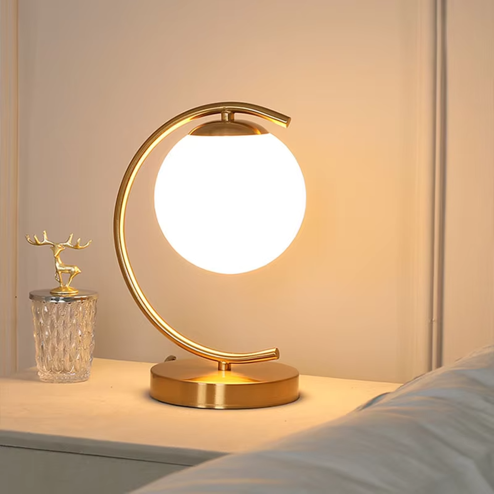 This is a modern minimalist metal frame table lamp, with a black oval metal stand paired with a white spherical frosted lampshade, featuring a simple and elegant design, both decorative and lighting functions, ideal for modern indoor scenarios such as desks and nightstands.