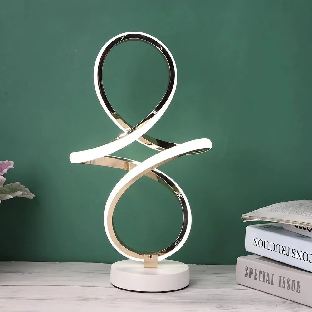 This light luxury art table lamp features a "8"/infinity symbol shape made of gold metal, with embedded LED light strips and a white marble base, serving both lighting and decorative purposes, ideal for living room side tables, bedroom bedside tables, light luxury homestays and other spaces.