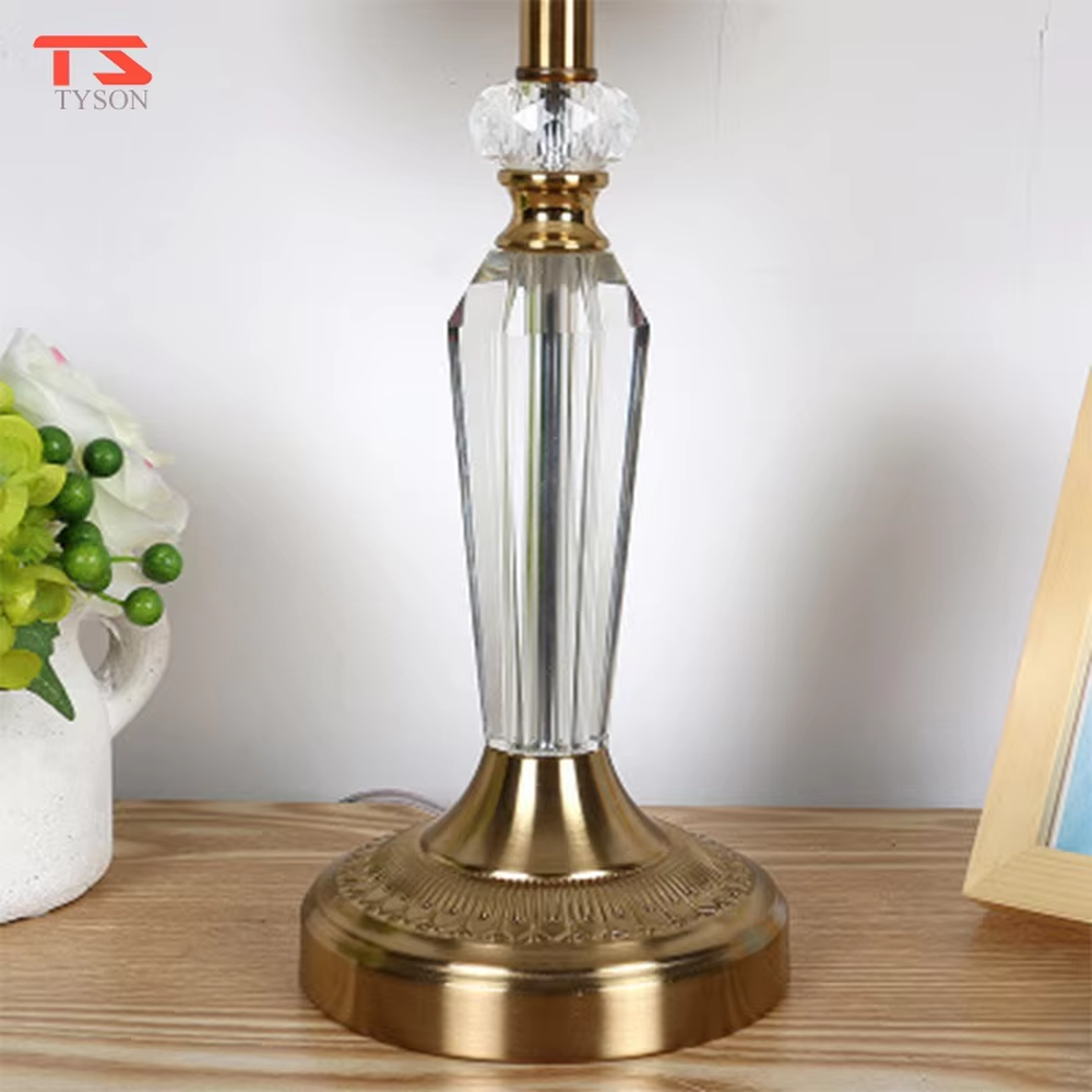Light luxury crystal fabric table lamp (pleated fabric lampshade + crystal lamp post + antique bronze metal base), warm light effect, creating an elegant and luxurious home atmosphere.