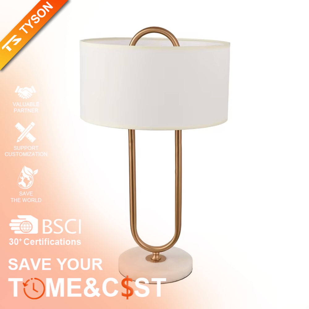 This modern light luxury table lamp features a U-shaped frame made of gold metal, paired with a white fabric rectangular lampshade and a white marble base, with a simple and elegant shape. It serves both lighting and decorative purposes, ideal for light luxury spaces such as bedroom bedside tables, living room side tables, and hotel guest rooms.