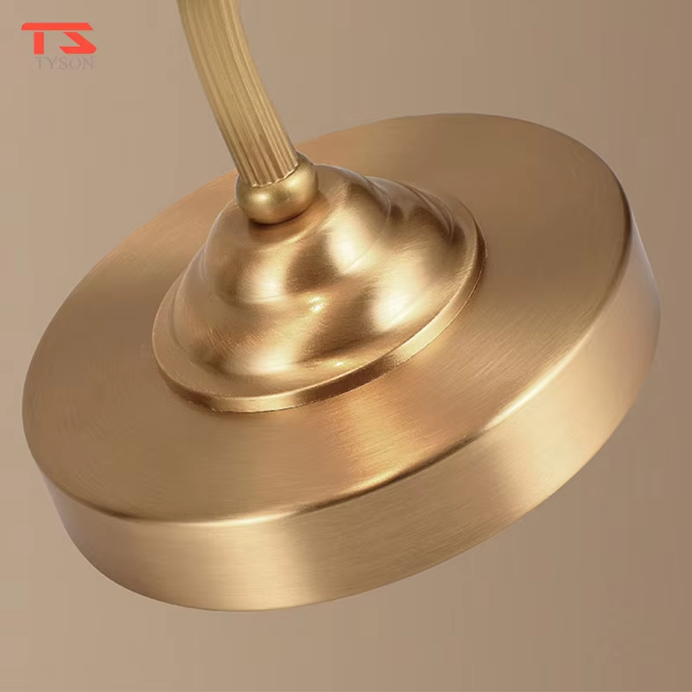 Vintage light luxury brass curved-arm petal lampshade table lamp, brass metal material + white petal translucent shade + warm light effect, creating an elegant and cozy home atmosphere.