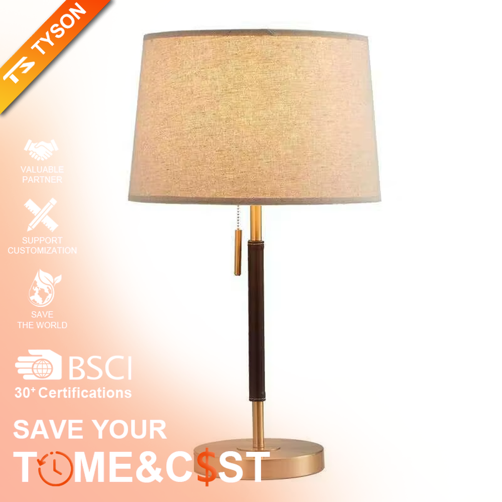 This is a minimalist light luxury table lamp, featuring an off-white linen fabric lampshade paired with a black and gold dual-color metal lamp pole, with a pull-chain switch. It emits soft and warm light, serving both lighting and decorative purposes, suitable for bedroom nightstands, living room side tables, studies, hotel guest rooms and other scenarios.