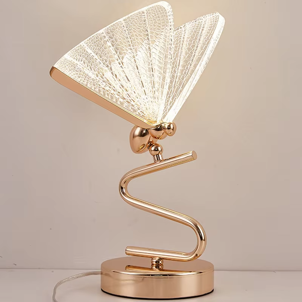 This light luxury modern table lamp features a gold S-shaped metal stand, paired with a ginkgo leaf-shaped textured translucent lampshade, supports angle adjustment, serves both lighting and decorative purposes, ideal for light luxury spaces such as bedroom bedside tables, living room side tables, and hotel guest rooms.