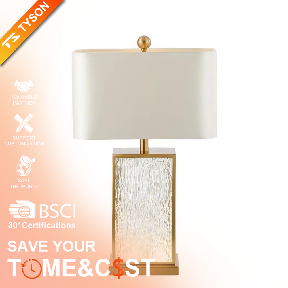 This modern light luxury table lamp features a gold metal frame, paired with a water-textured transparent glass lamp body and a white fabric rectangular lampshade. It serves both lighting and decorative purposes, ideal for light luxury spaces such as bedroom bedside tables, living room side tables, and hotel guest rooms.