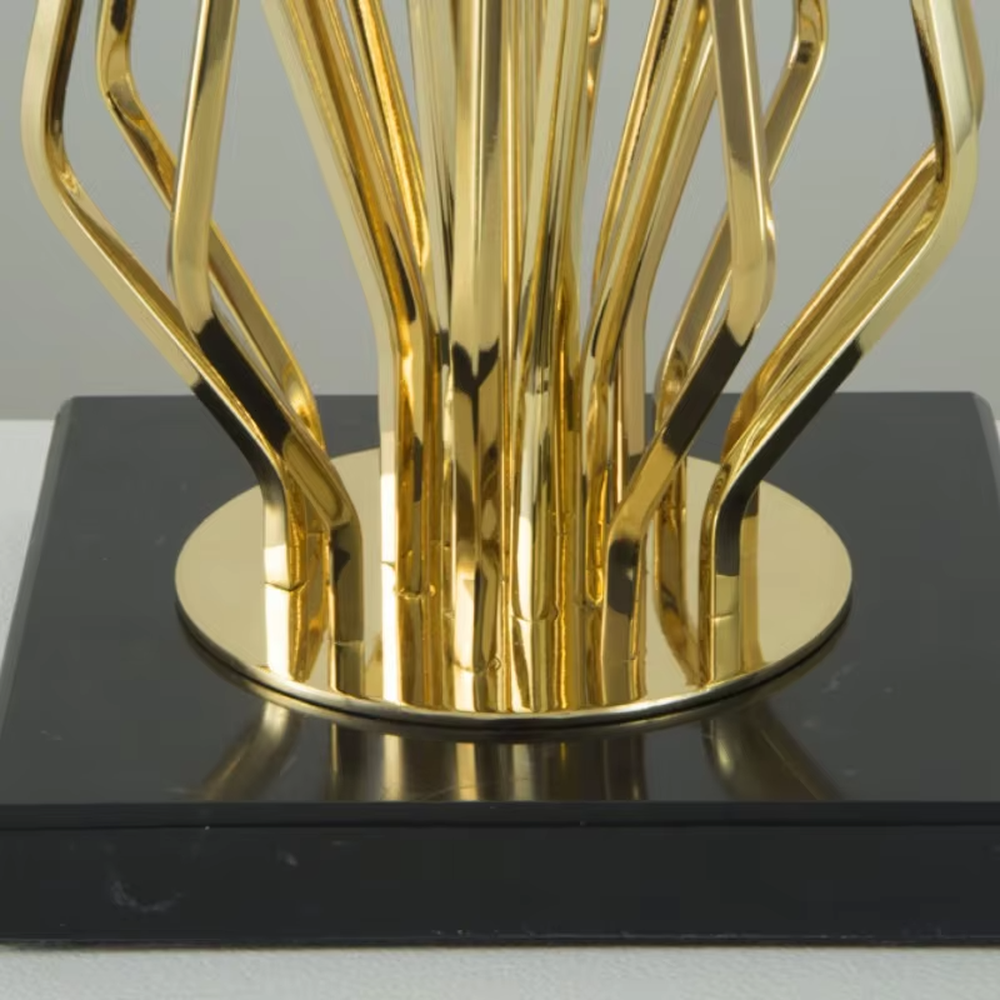 Modern art golden geometric line table lamp (white shade + black base), warm light effect, creating a high-end minimalist creative space atmosphere.