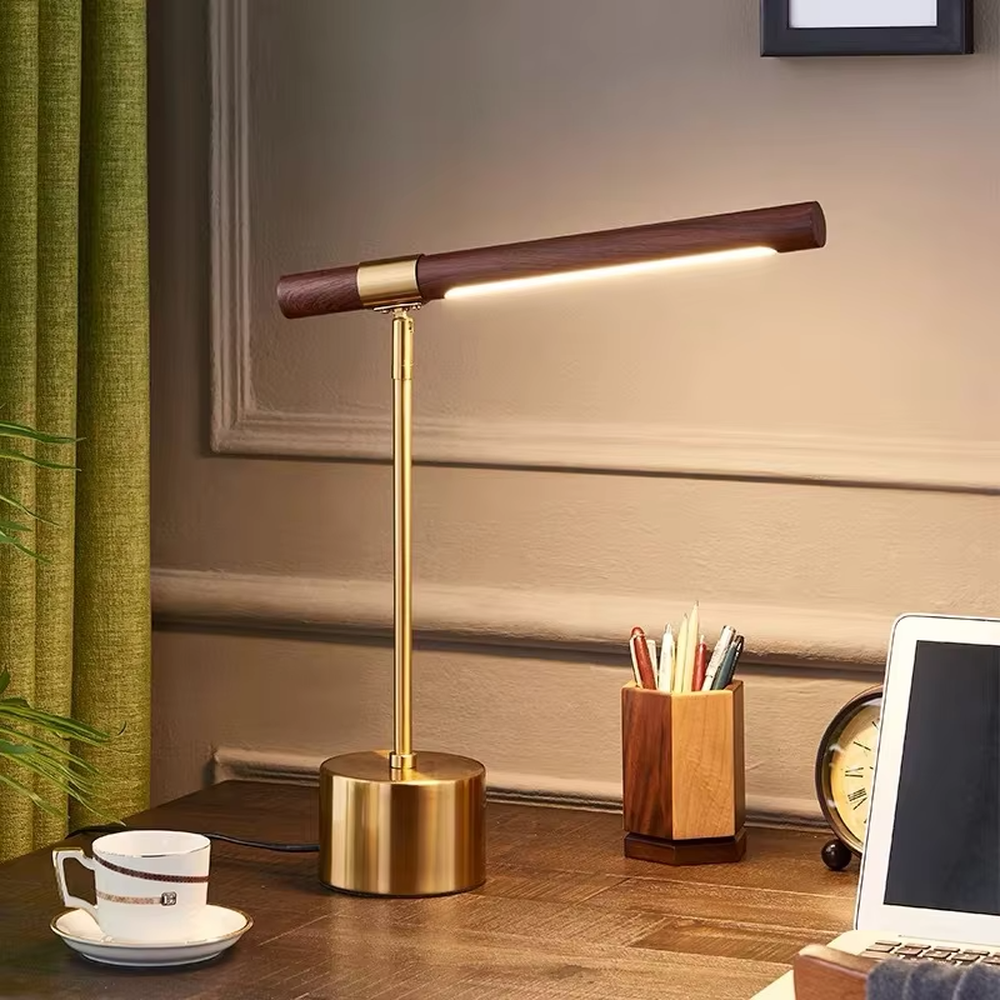 This is a modern minimalist style eye-protecting table lamp, featuring a walnut lamp head paired with a brass metal lamp pole and base. The linear lighting design is soft and non-glaring, serving both practical lighting and decorative purposes, suitable for study rooms, bedroom nightstands, light luxury office areas and other scenarios.