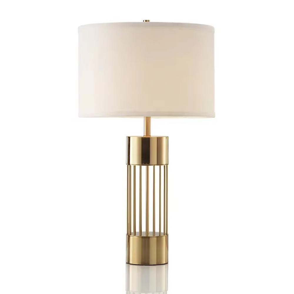 This light luxury table lamp features a gold metal hollow vertical strip column base, paired with a white fabric cylindrical lampshade and a top gold spherical decoration, with a simple and elegant shape, serving both lighting and decorative purposes, ideal for bedroom bedside tables, living room side tables, light luxury homestays and other spaces.
