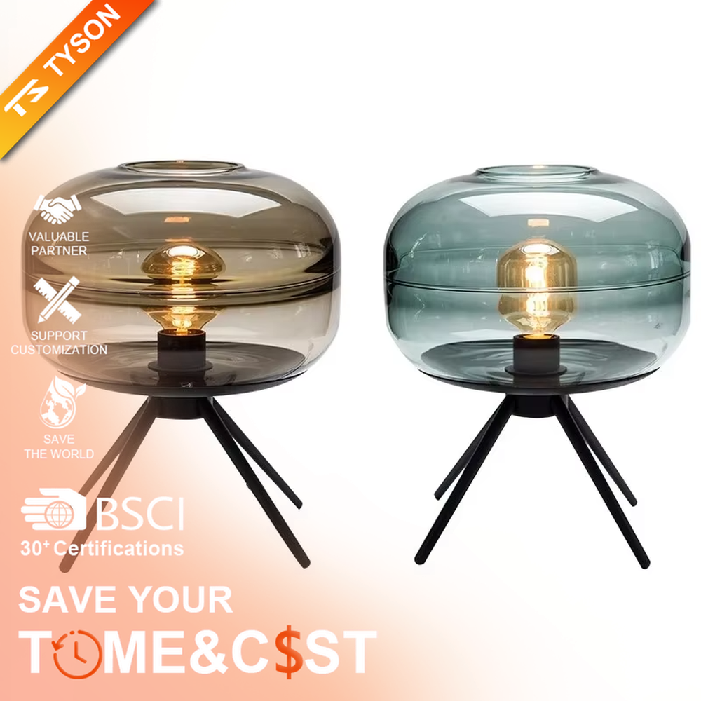 This set of Nordic-style glass lighting includes a table lamp and a chandelier, with drum-shaped lampshades made of blue-gray gradient glass. The table lamp is paired with a black tripod base, and the chandelier uses a suspension design, emitting soft and transparent light, serving both lighting and decorative purposes, ideal for bedrooms, dining rooms, Nordic-style homes and internet-famous shops and other scenarios.