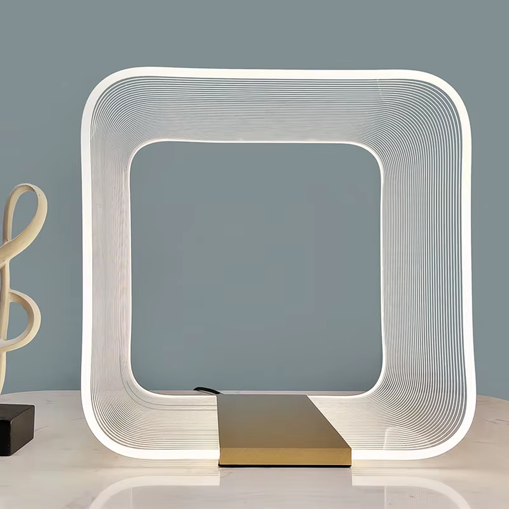 Avant-garde line frame table lamp (white line frame + gold base), warm light effect, creating a futuristic high-end space atmosphere.