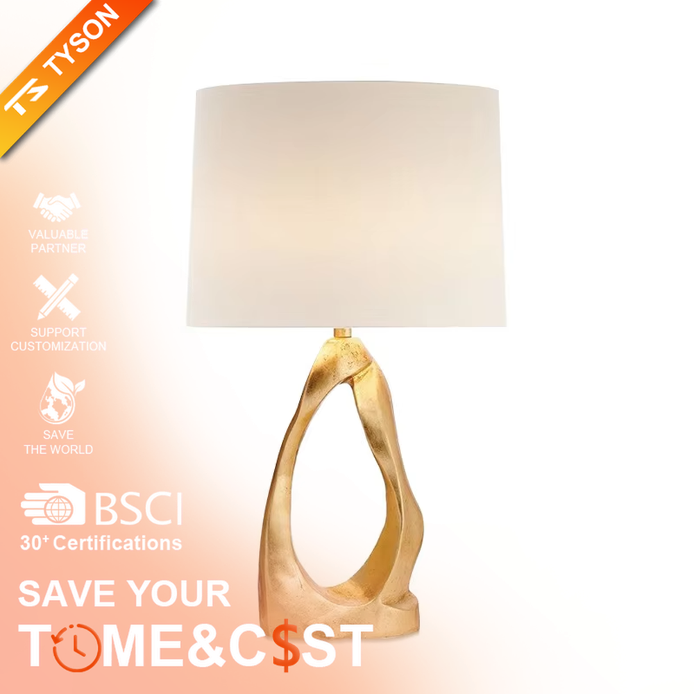 Art texture gold base table lamp (irregular gold base + fabric shade), warm light effect, creating an artistic and high-end light luxury home atmosphere.