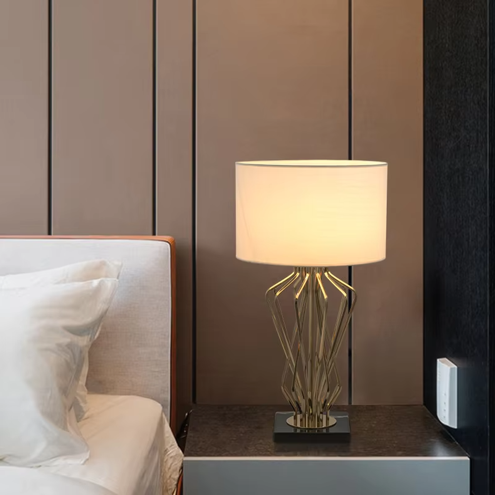 Modern art golden geometric line table lamp (white shade + black base), warm light effect, creating a high-end minimalist creative space atmosphere.