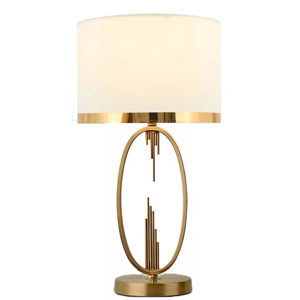 Light luxury style gold metal table lamp, featuring an oval hollow frame with pendant line decorations, paired with an off-white fabric lampshade with a gold trim at the bottom. It emits soft and elegant light, combining artistic decorativeness and lighting practicality, suitable for atmosphere creation and embellishment in bedrooms, living rooms, hotels and other spaces.