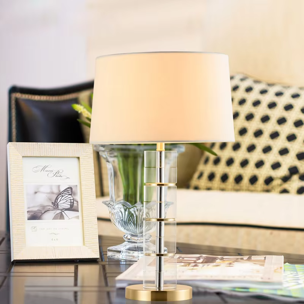 Light Luxury Stacked Acrylic Table Lamp (Off-white Fabric Umbrella Lampshade + Transparent Acrylic Stacked Lamp Post + Gold Metal Base), warm light effect, creating an exquisite and elegant home atmosphere.