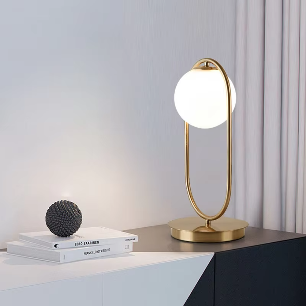 Minimalist gold ring glass ball table lamp (gold ring stand + milk white glass ball), warm light effect, creating a simple and high-end light luxury home atmosphere.
