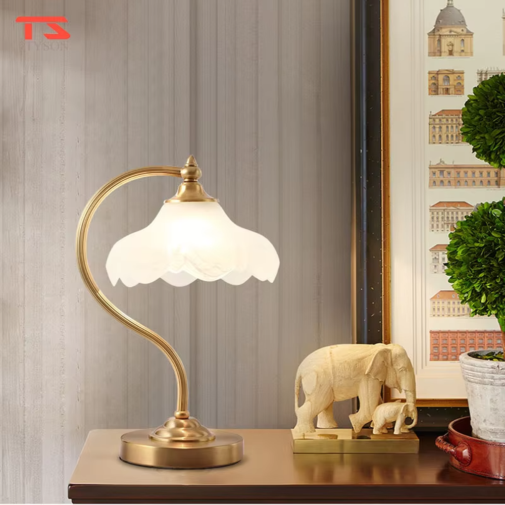 Vintage light luxury brass curved-arm petal lampshade table lamp, brass metal material + white petal translucent shade + warm light effect, creating an elegant and cozy home atmosphere.