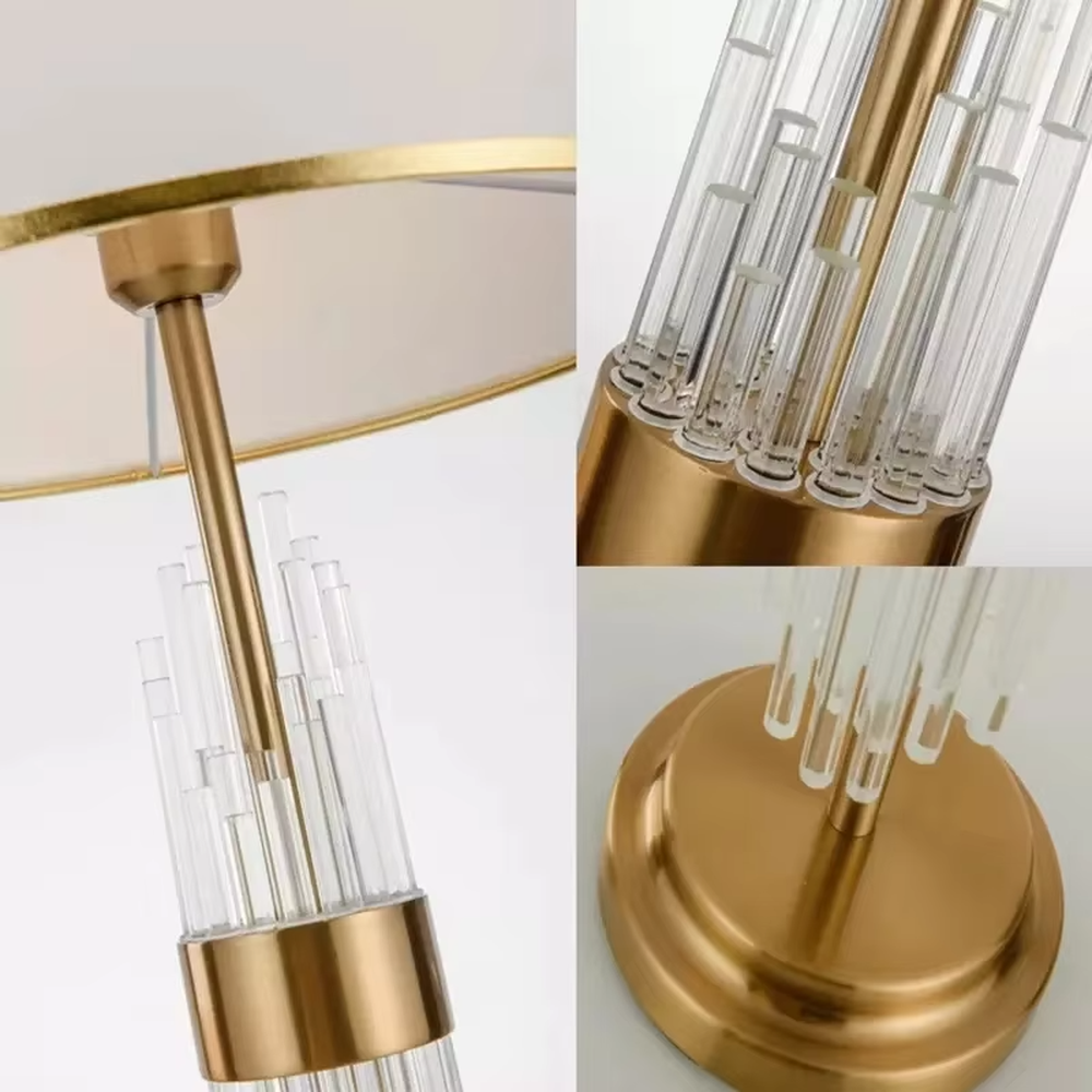Light luxury style crystal and metal segmented table lamp, featuring transparent crystal columns paired with gold metal accessories, and an off-white fabric lampshade with a gold trim at the bottom. It emits soft and warm light, combining decorativeness and practicality, suitable for lighting and decoration in spaces such as bedroom nightstands, living room side tables, and hotel guest rooms.
