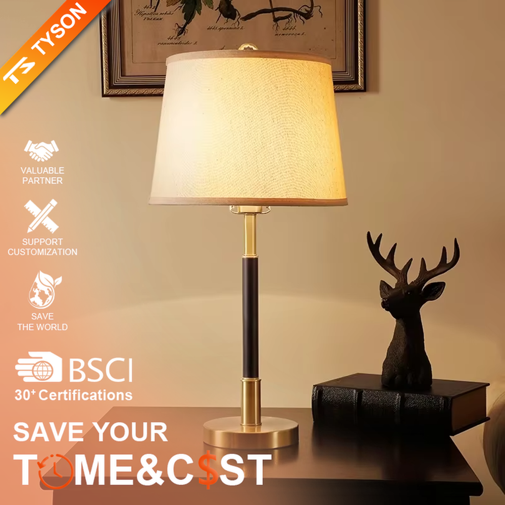 This table lamp features a black and gold contrasting metal lamp pole paired with an off-white fabric lampshade, with a glossy gold metal base. It presents a style that combines modern light luxury and minimalist retro, with soft eye-protective light, serving both lighting and decorative purposes, suitable for placement in bedrooms, studies and other spaces.