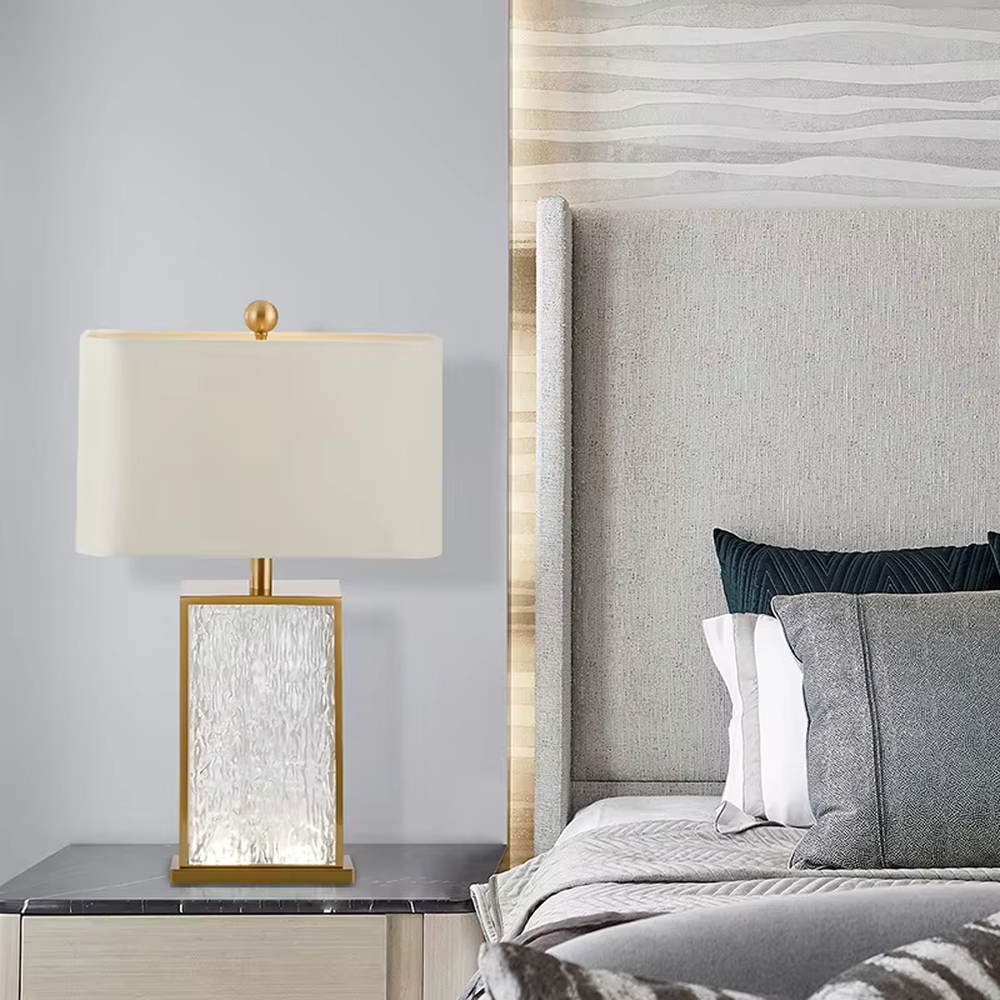 Light luxury golden frame ice-textured glass square table lamp (satin white shade), warm light effect, creating an exquisite and high-end space atmosphere.