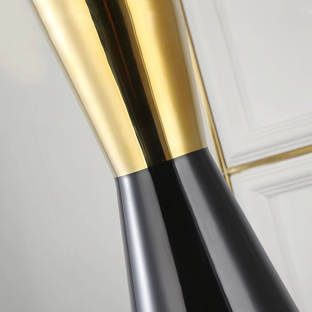 This is a light luxury black-gold table lamp, with a black fabric lampshade edged with gold trim, and a cone-shaped base with a black-gold color block design, featuring both decorative and lighting functions, ideal for high-end indoor scenarios such as bedroom nightstands and living room side tables.