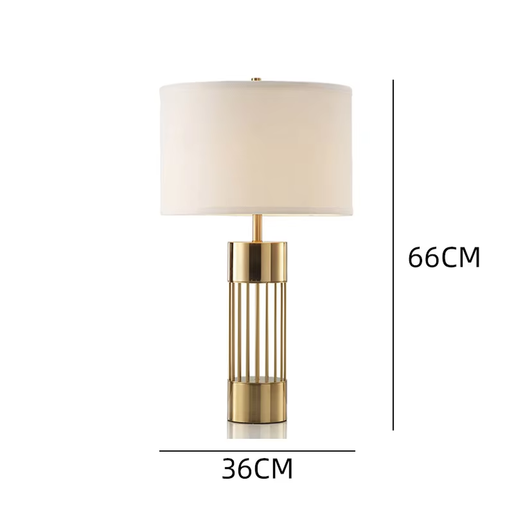 This light luxury table lamp features a gold metal hollow vertical strip column base, paired with a white fabric cylindrical lampshade and a top gold spherical decoration, with a simple and elegant shape, serving both lighting and decorative purposes, ideal for bedroom bedside tables, living room side tables, light luxury homestays and other spaces.
