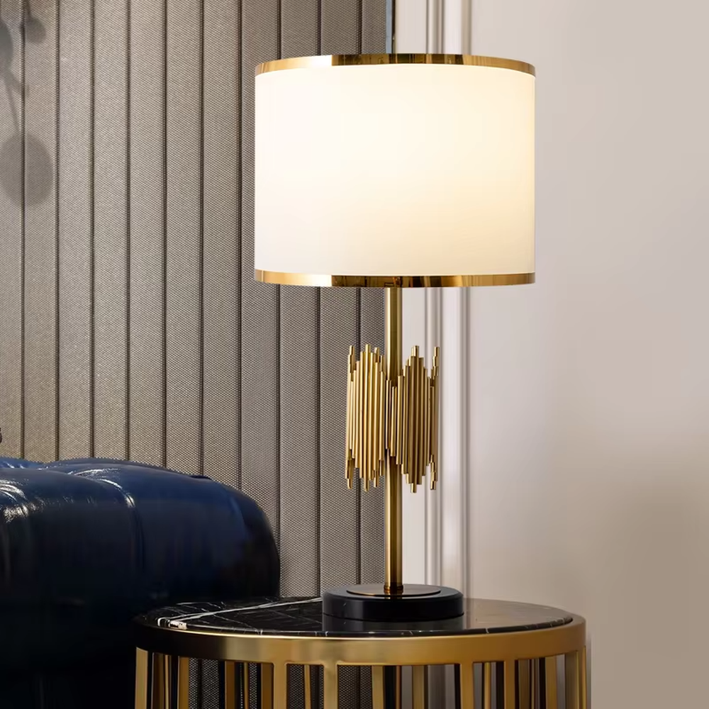 Modern light luxury black-gold striped decorative table lamp, golden metal striped base + white shade with gold trim + warm light effect, creating an exquisite luxurious home atmosphere.