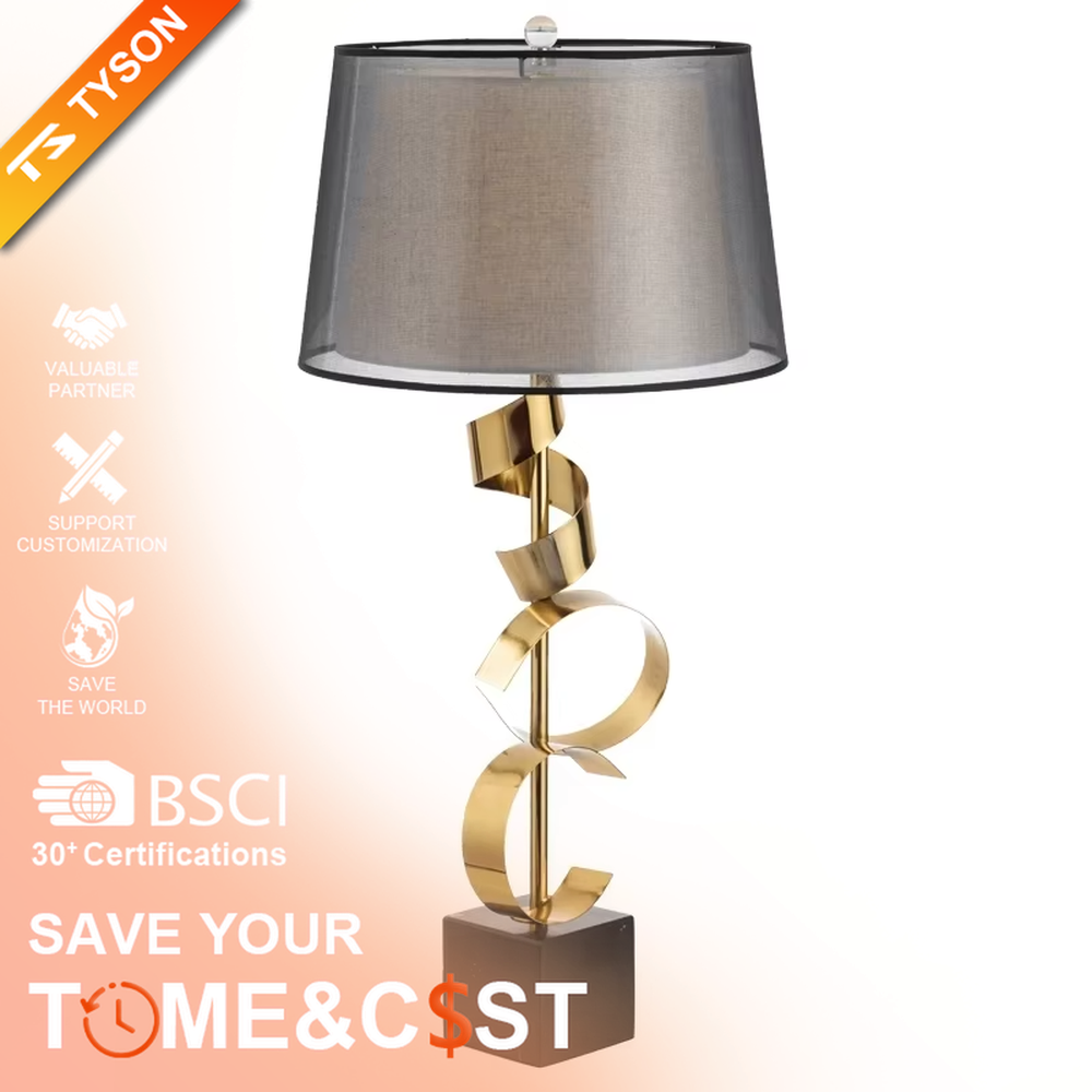 Light luxury spiral metal table lamp (gold spiral pole + pink-brown fabric shade), warm light effect, creating a dynamic and high-end warm space atmosphere.
