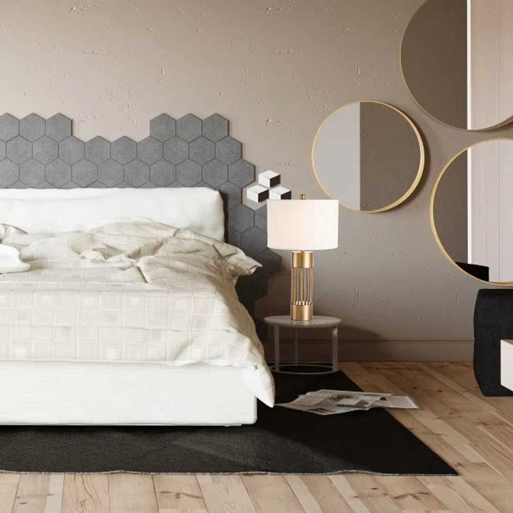 This light luxury table lamp features a gold metal hollow vertical strip column base, paired with a white fabric cylindrical lampshade and a top gold spherical decoration, with a simple and elegant shape, serving both lighting and decorative purposes, ideal for bedroom bedside tables, living room side tables, light luxury homestays and other spaces.