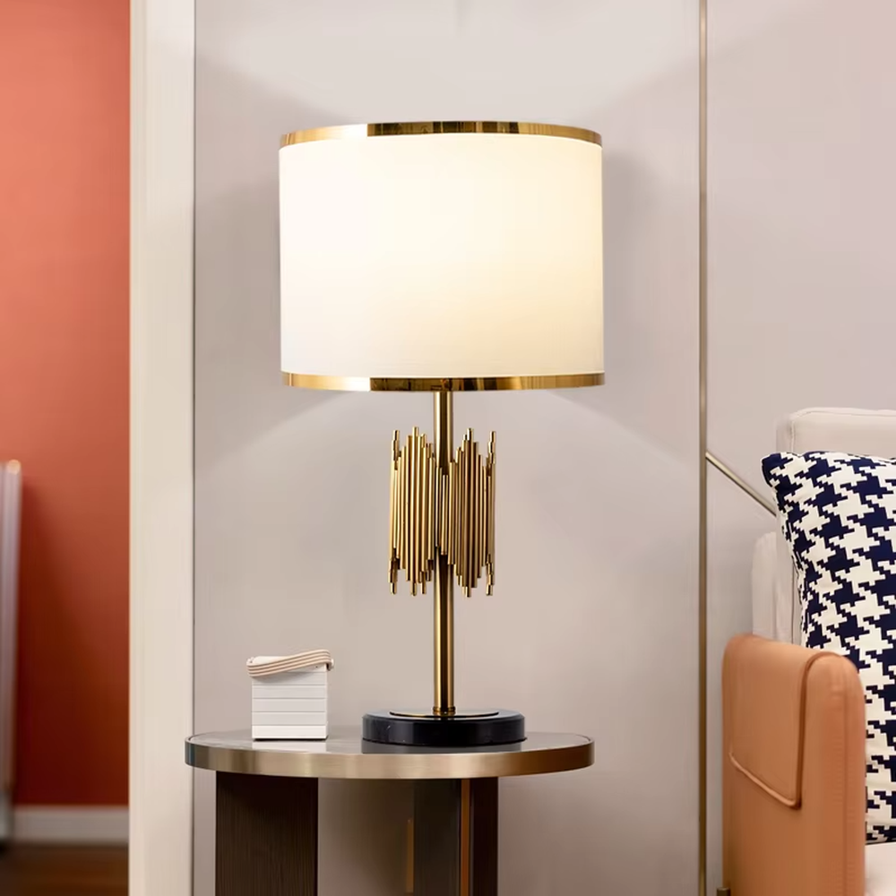 Modern light luxury black-gold striped decorative table lamp, golden metal striped base + white shade with gold trim + warm light effect, creating an exquisite luxurious home atmosphere.