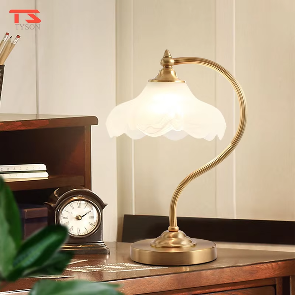 Vintage light luxury brass curved-arm petal lampshade table lamp, brass metal material + white petal translucent shade + warm light effect, creating an elegant and cozy home atmosphere.