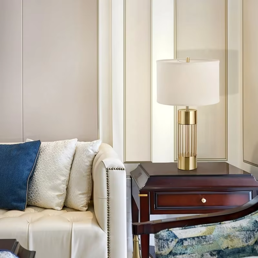 Light luxury gold grid cylinder table lamp (gold grid base + fabric lampshade), warm light effect, creating a high-end minimalist home atmosphere.