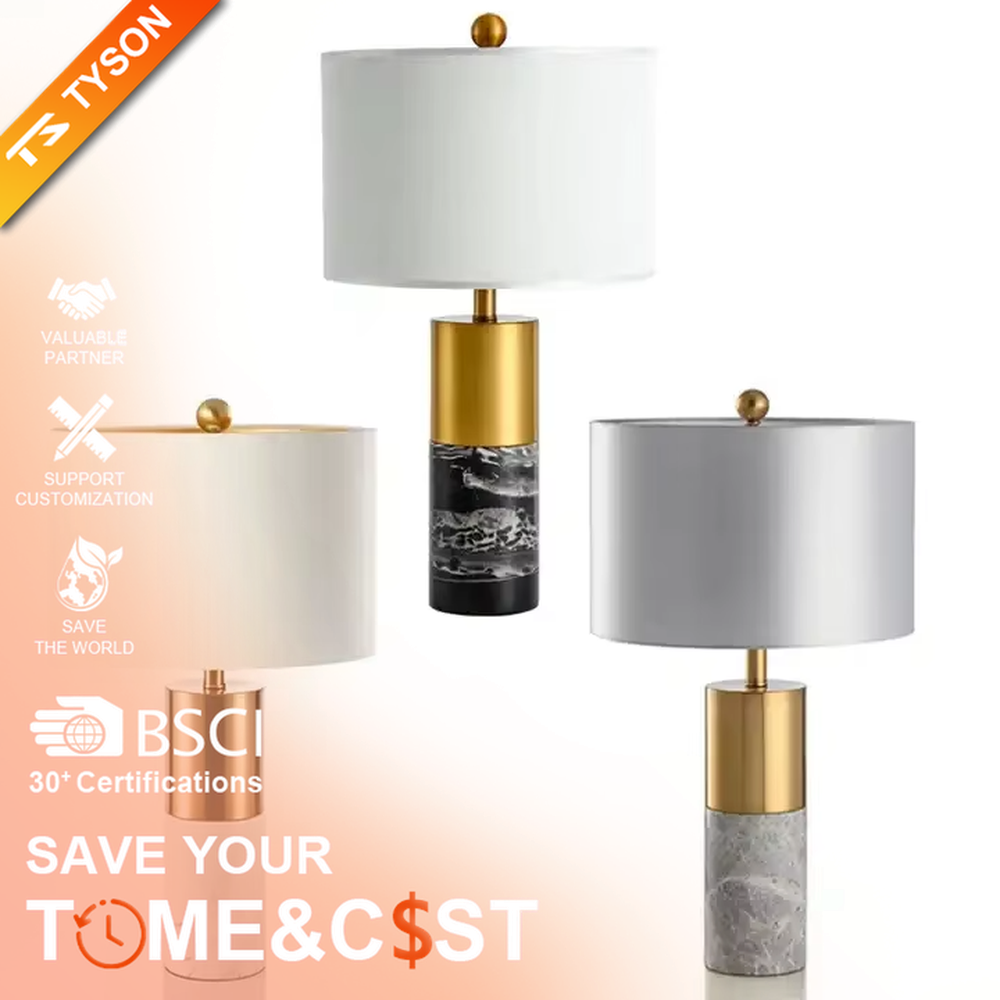 This light luxury modern table lamp features a lamp post made of black marble and gold metal, paired with an off-white fabric cylindrical lampshade. It has a calm and elegant shape, serves both lighting and decorative purposes, and is ideal for bedroom bedside tables, living room side tables, hotel guest rooms and light luxury commercial spaces.