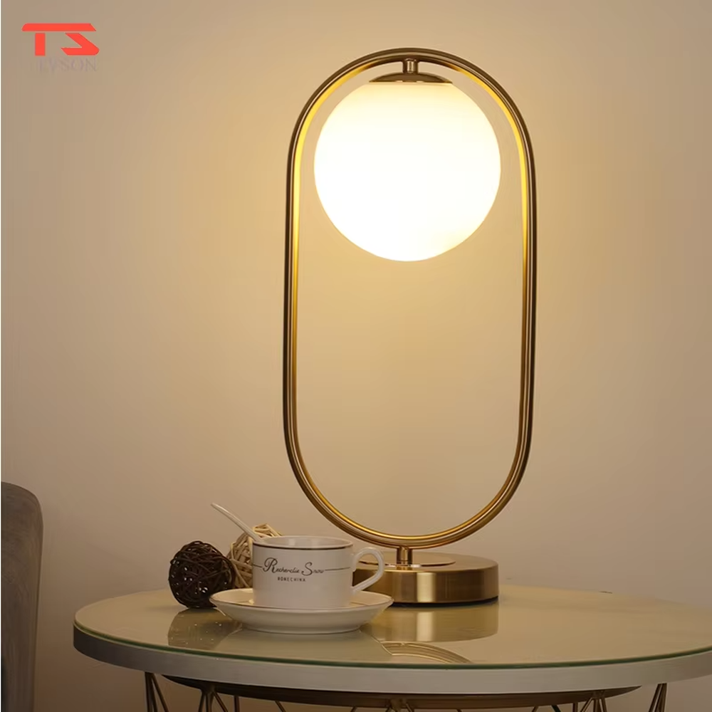 Modern minimalist oval-frame spherical table lamp, with a black metal oval frame paired with a milky white luminous bulb, emitting soft and even light, combining decorativeness and practicality, suitable for lighting and decoration in spaces such as bedroom nightstands, living room side tables, and office desks.