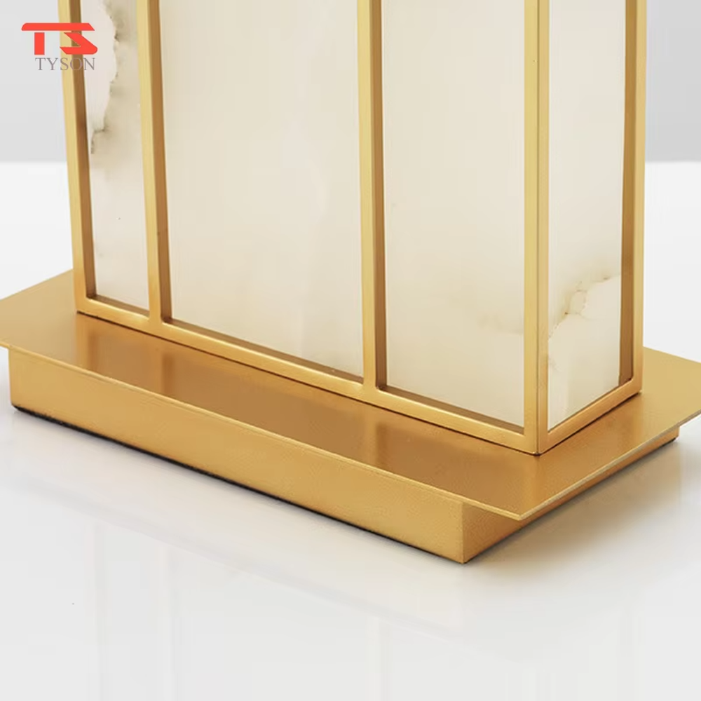 This is a new Chinese style table lamp, featuring a rectangular fabric lampshade paired with a geometric splicing base with Chinese architectural elements, which has both lighting and decorative functions, suitable for bedrooms, studies, tea rooms, new Chinese-style homes and hotel guest rooms and other spaces.