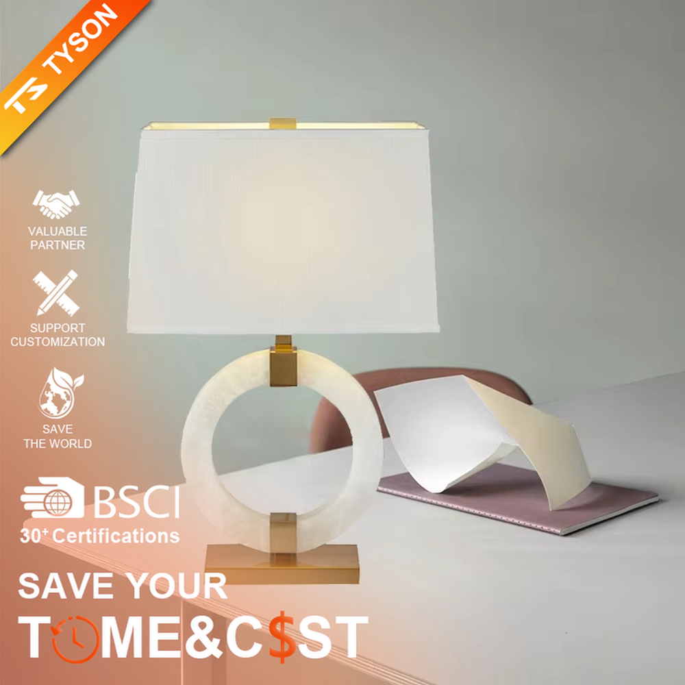 Light luxury white jade ring base table lamp, white jade-textured ring + golden metal decorations + white fabric lampshade, soft warm light, creating a light luxury elegant home atmosphere.