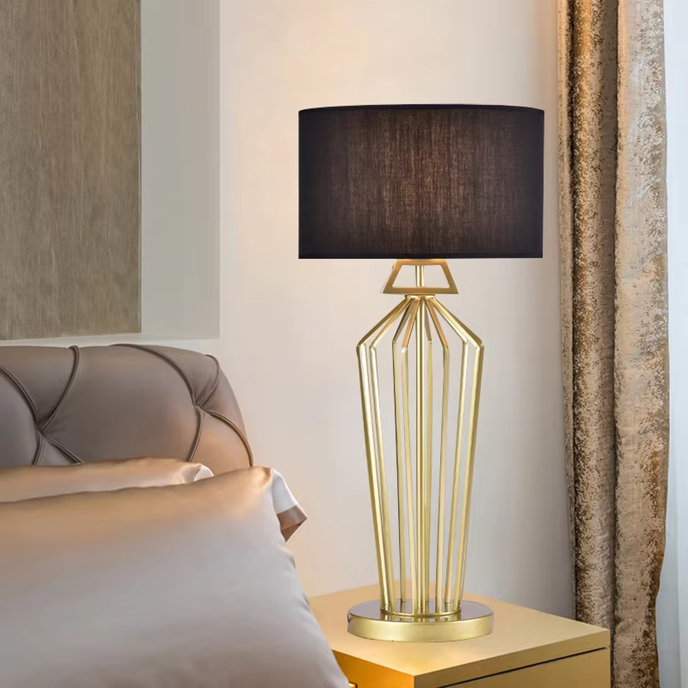 Modern Light Luxury Geometric Hollow Metal Table Lamp, Black Cylindrical Fabric Lampshade, Gold Prism Hollow Metal Lamp Body, Serves Both Lighting and Decorative Purposes, Ideal for Bedrooms, Living Rooms, Studies, Hotel Guest Rooms and Other Light Luxury Spaces.